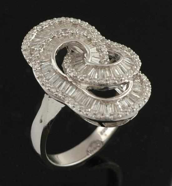 Appraisal: A diamond dress ring Of looped abstract design set with