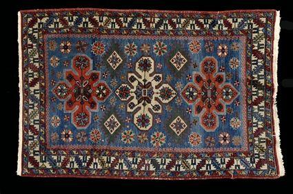 Appraisal: SHIRVAN RUG The light blue field worked with terracotta and