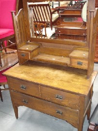 Appraisal: An Arts and Craft pine dressing table with mirror back