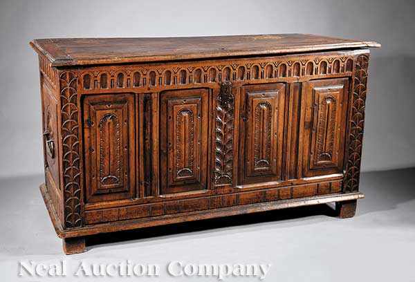 Appraisal: An Antique Italian Carved Walnut Cassone the molded plank top