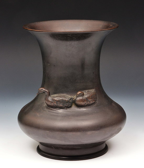 Appraisal: A Japanese bronze vaseMeiji periodof baluster form with tapered neck