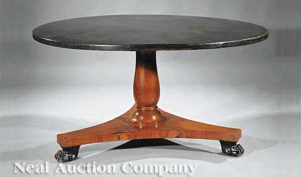 Appraisal: A Neoclassical Style Mahogany and Ebonized Dining Table circular top