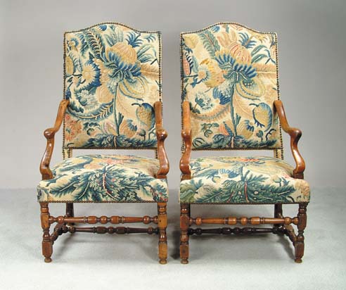 Appraisal: OUTSTANDING PAIR OF CONTINENTAL BAROQUE CARVED WALNUT OPEN ARMCHAIRS Probably