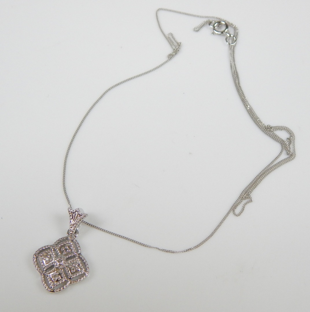 Appraisal: A ct white gold pendant and chain in the form