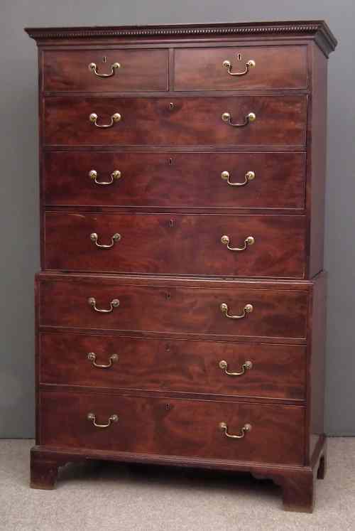 Appraisal: A George III mahogany tallboy with moulded and dentil cresting