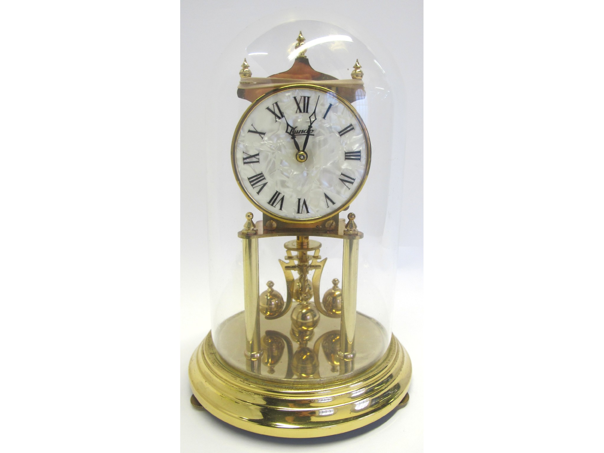 Appraisal: Kundo gilt metal and domed glass mantle clock