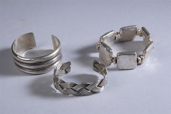 Appraisal: THREE PERUVIAN STERLING SILVER BRACELETS Circa s- s Including banded