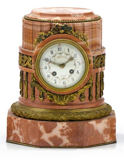 Appraisal: French gilt bronze mounted pink marble mantle clock retailed by