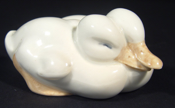 Appraisal: Royal Copenhagen porcelain sleeping duck group with hand painted decoration