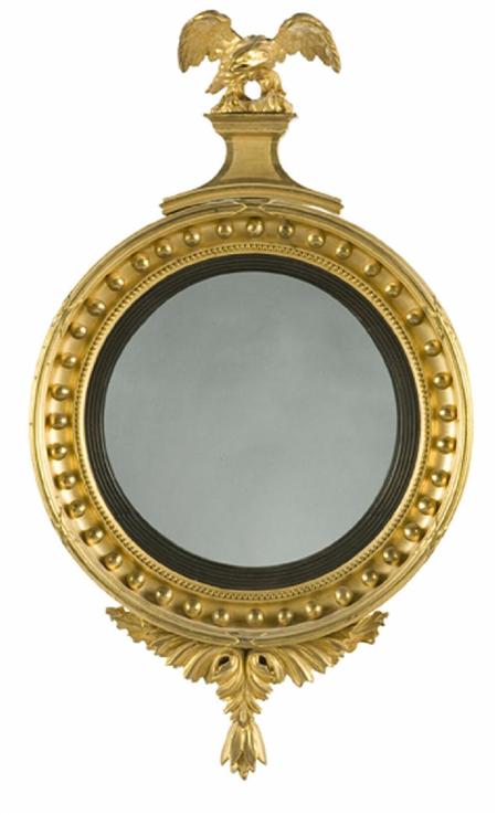 Appraisal: A small Regency giltwood and gesso convex mirror the eagle