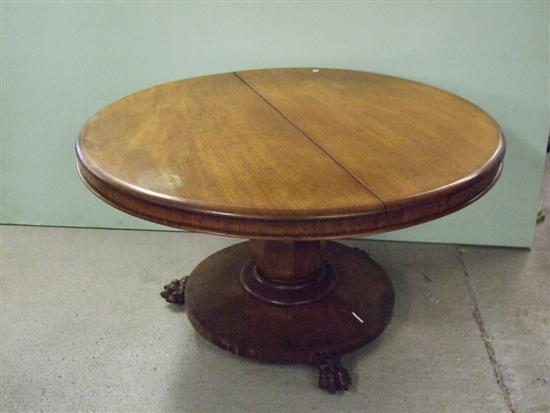 Appraisal: A th century mahogany breakfast table on column support to