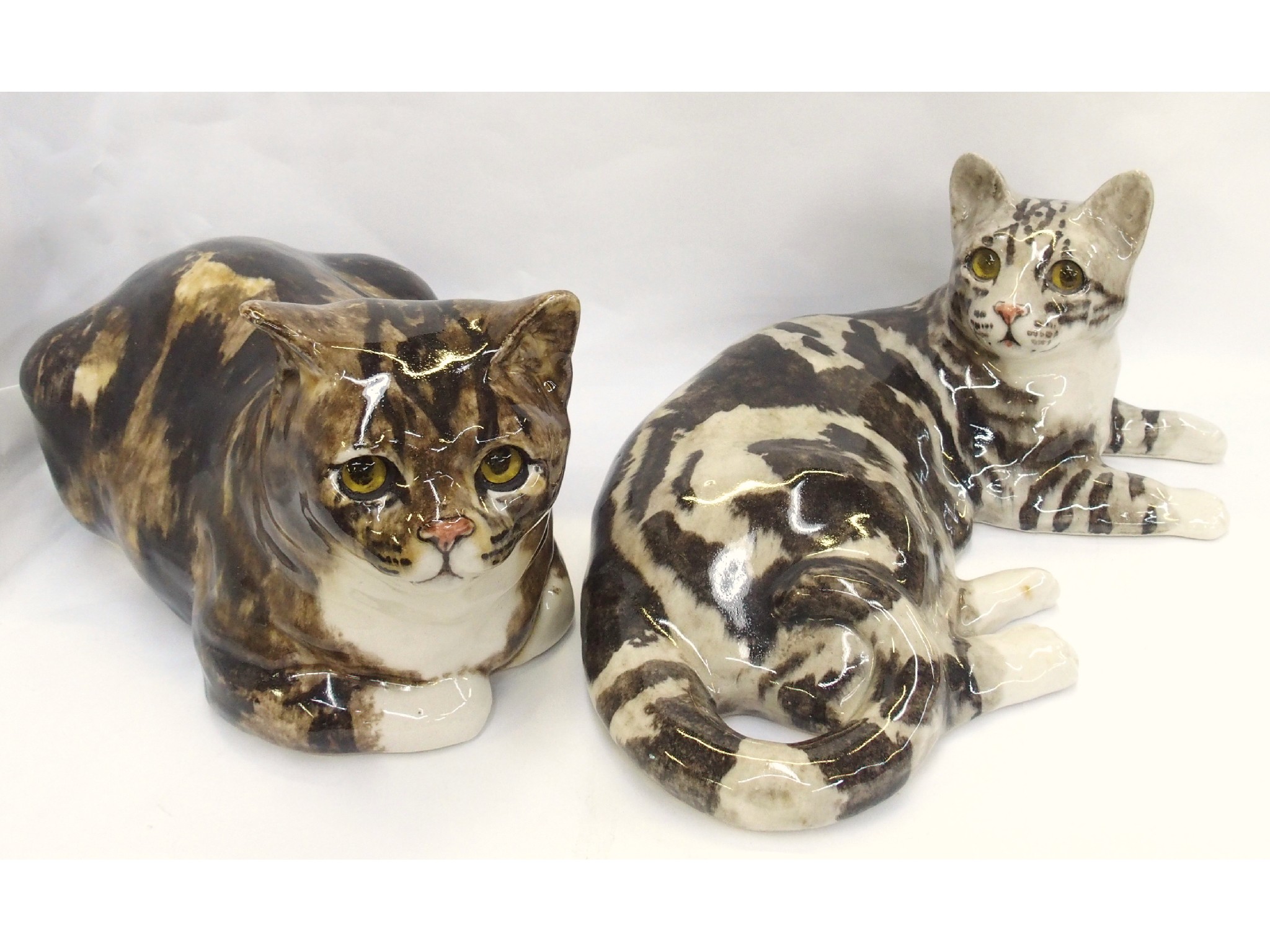 Appraisal: Two Winstanley English pottery figures of cats