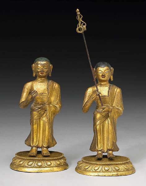 Appraisal: A pair of Sino-Tibetan gilt bronze Buddhist monks th Century