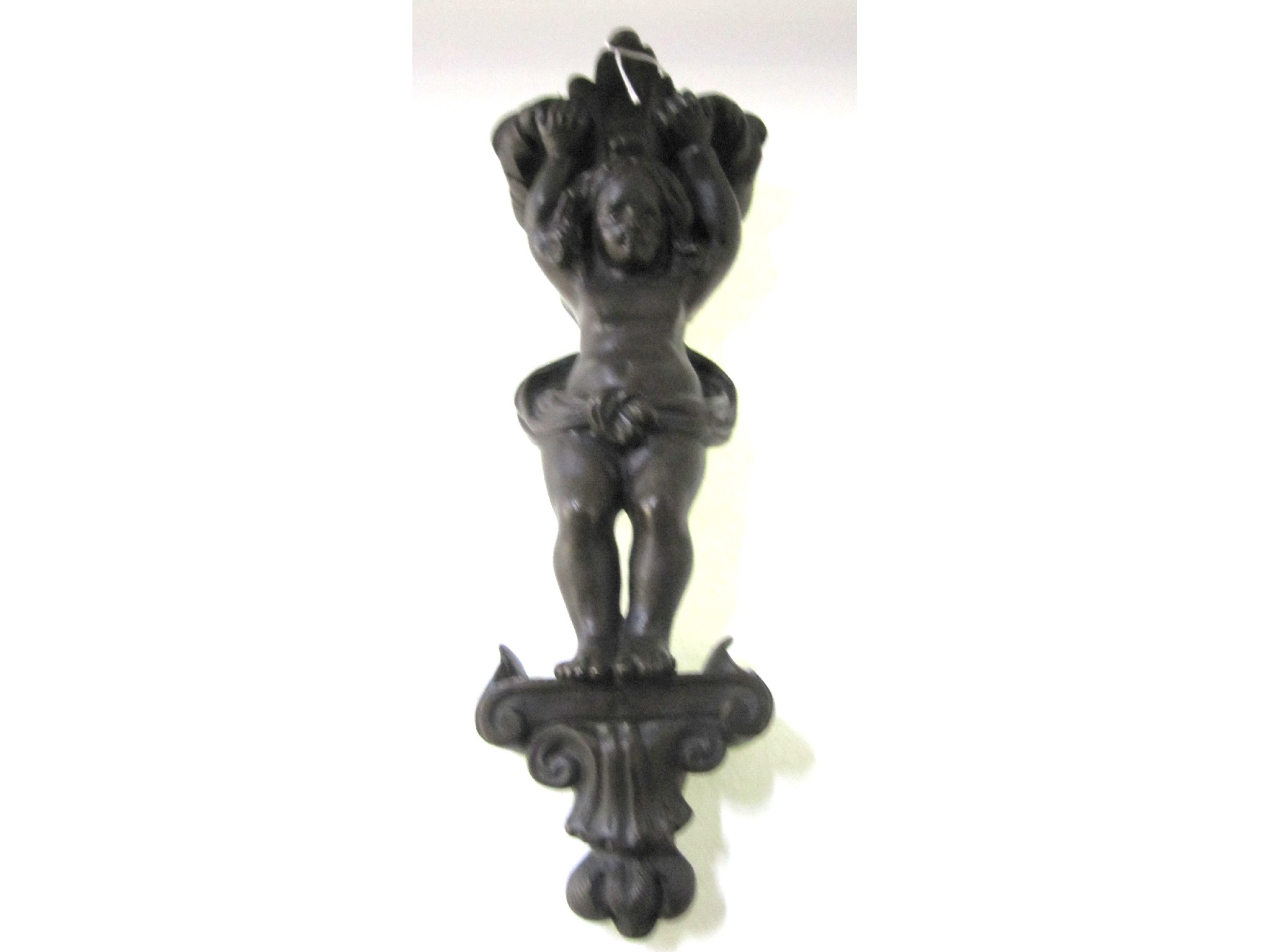 Appraisal: A cast metal decorative figural mount