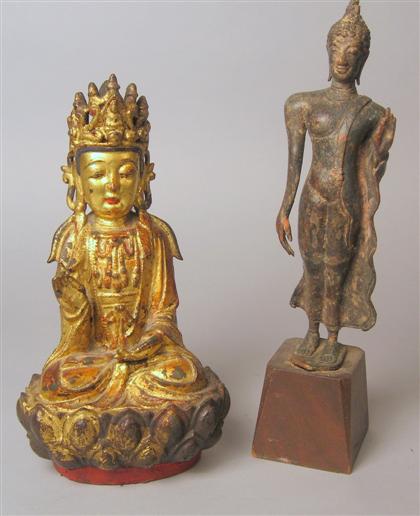 Appraisal: Gilt bronze deity together with Thai bronze walking Buddha Heavily