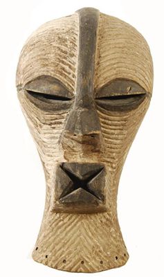 Appraisal: A Sonje Kifwebe mask with allover grooved decoration and decorated