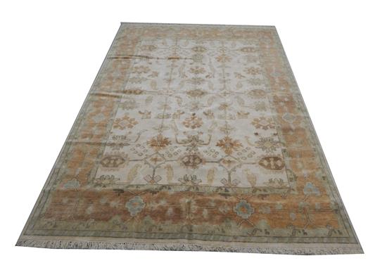 Appraisal: RUG Oushak ' x cream field with bronze border accents