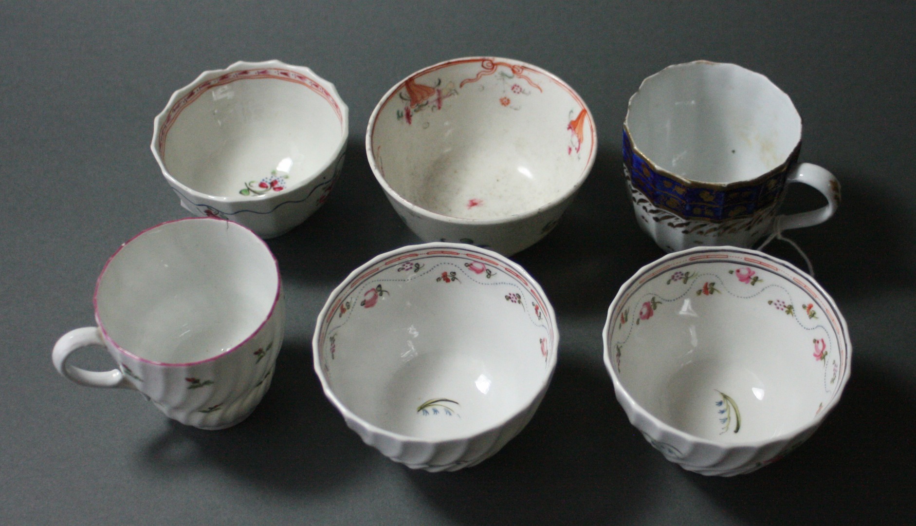 Appraisal: A Factory 'X' tea bowl with fluted sides a cup