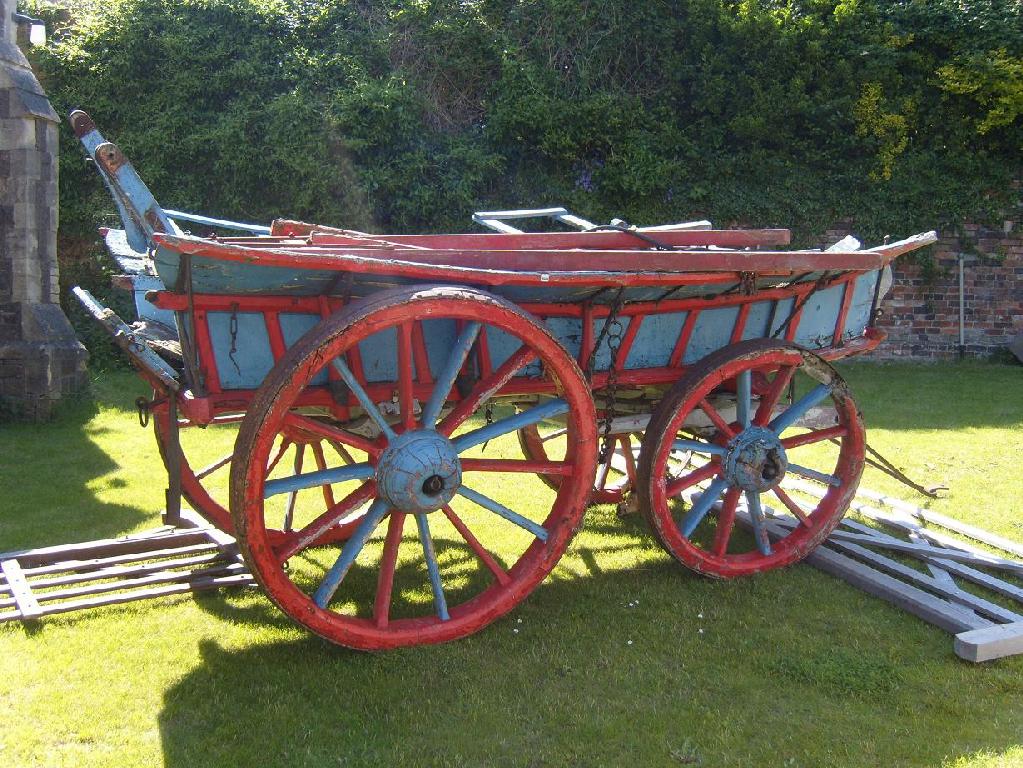 Appraisal: A traditional th century painted four wheel hay wagon all