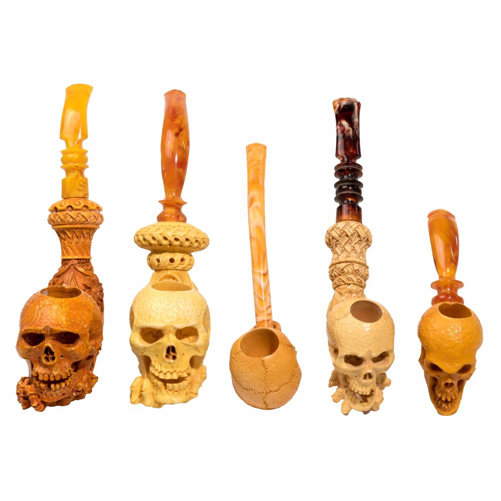 Appraisal: MEERSCHAUM SKULL SMOKING PIPE ASSORTMENT pipes carved from sepiolite Meerschaum