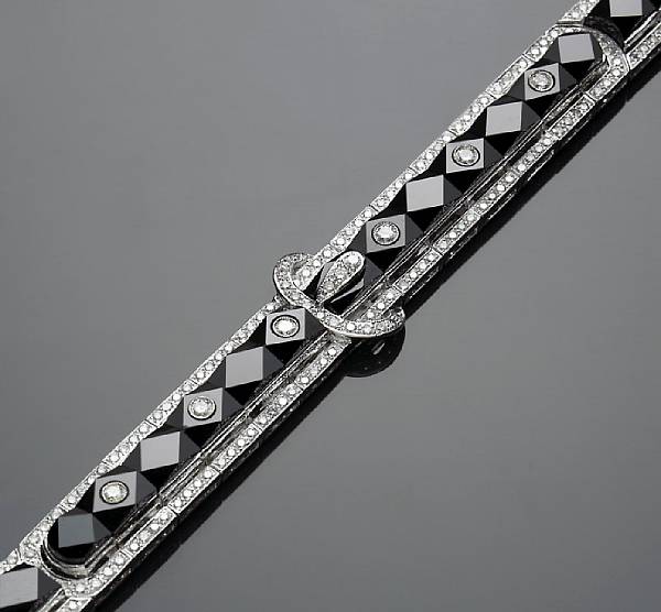 Appraisal: A black onyx and diamond buckle style bracelet estimated total