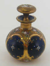 Appraisal: A globular Bristol blue scent flask with enamelled flowers in