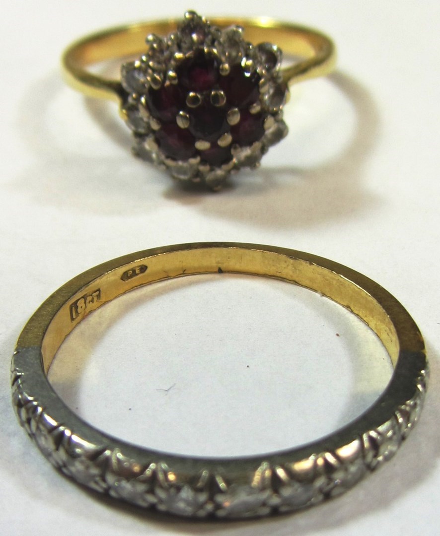 Appraisal: A gold ruby and diamond set hexagonal cluster ring mounted