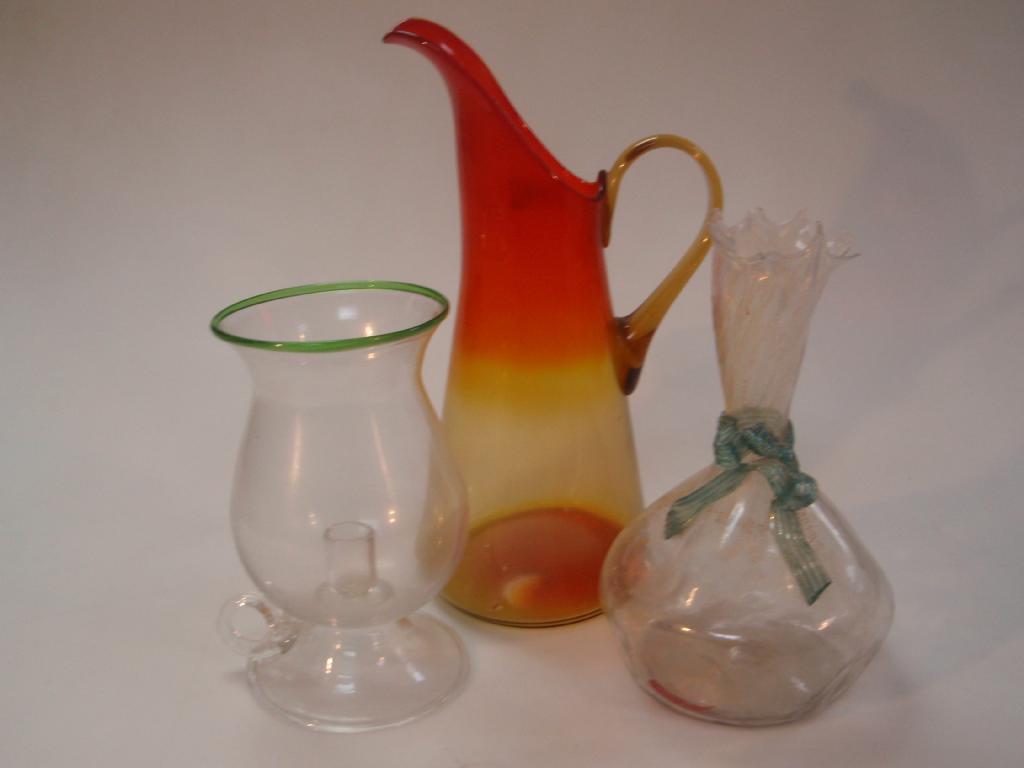 Appraisal: An Amberina orange and yellow graduated coloured ewer and two