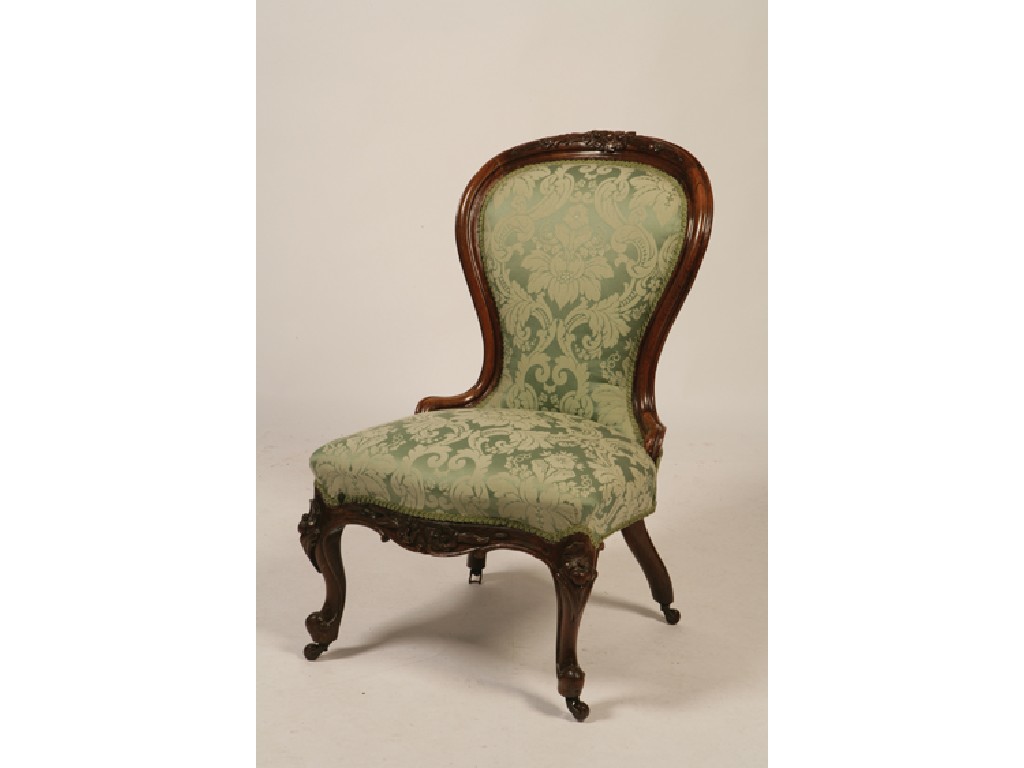 Appraisal: A PAIR OF VICTORIAN ROSEWOOD AND ROSEWOOD EFFECT UPHOLSTERED ARMCHAIRS