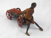 Appraisal: A vintage tinplate French SGDG wind up toy a black