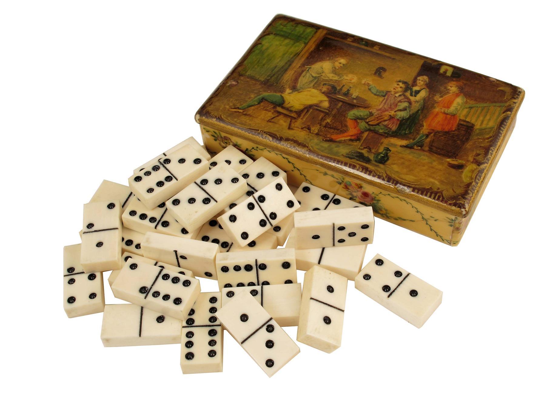 Appraisal: A cased set of miniature ivory dominoes