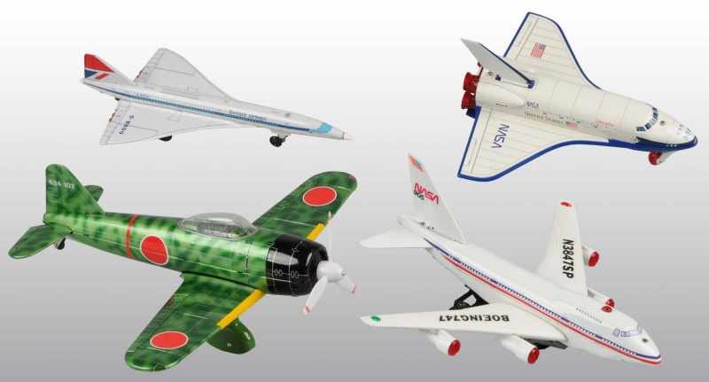 Appraisal: Lot of Tin Plastic Airplane Toys Description Working Includes one