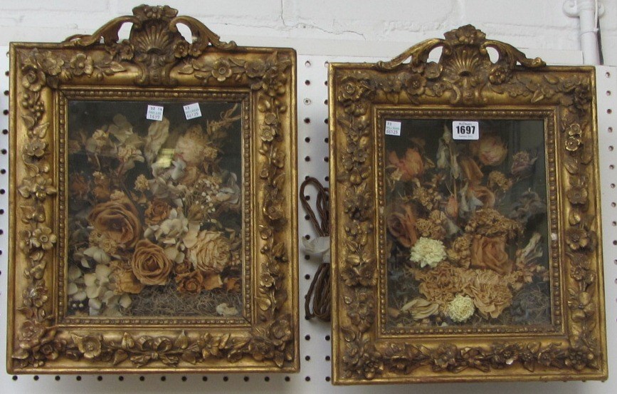 Appraisal: A pair of decoupage dried flower arrangements each mounted in