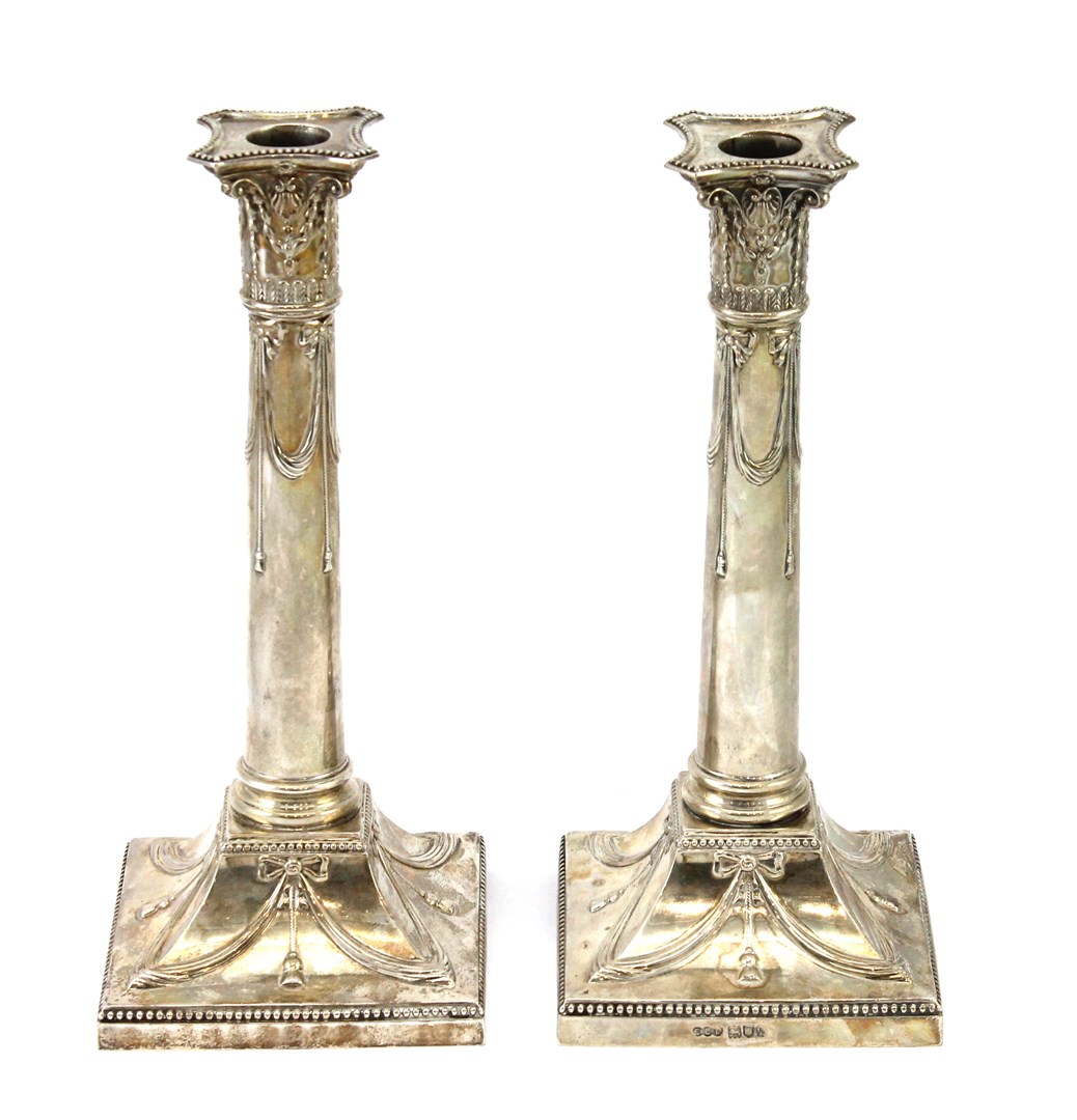 Appraisal: Two similar silver table candlesticks each of classical column form