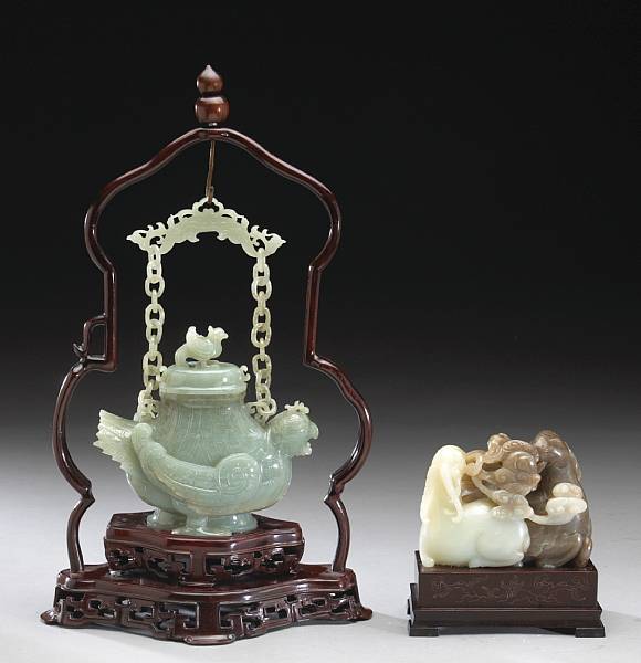 Appraisal: Two jade carvings The first a ram group the parents