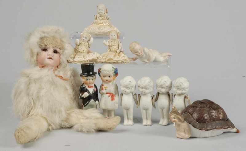 Appraisal: Lot of Antique Doll Novelties Description Snow Baby doll with