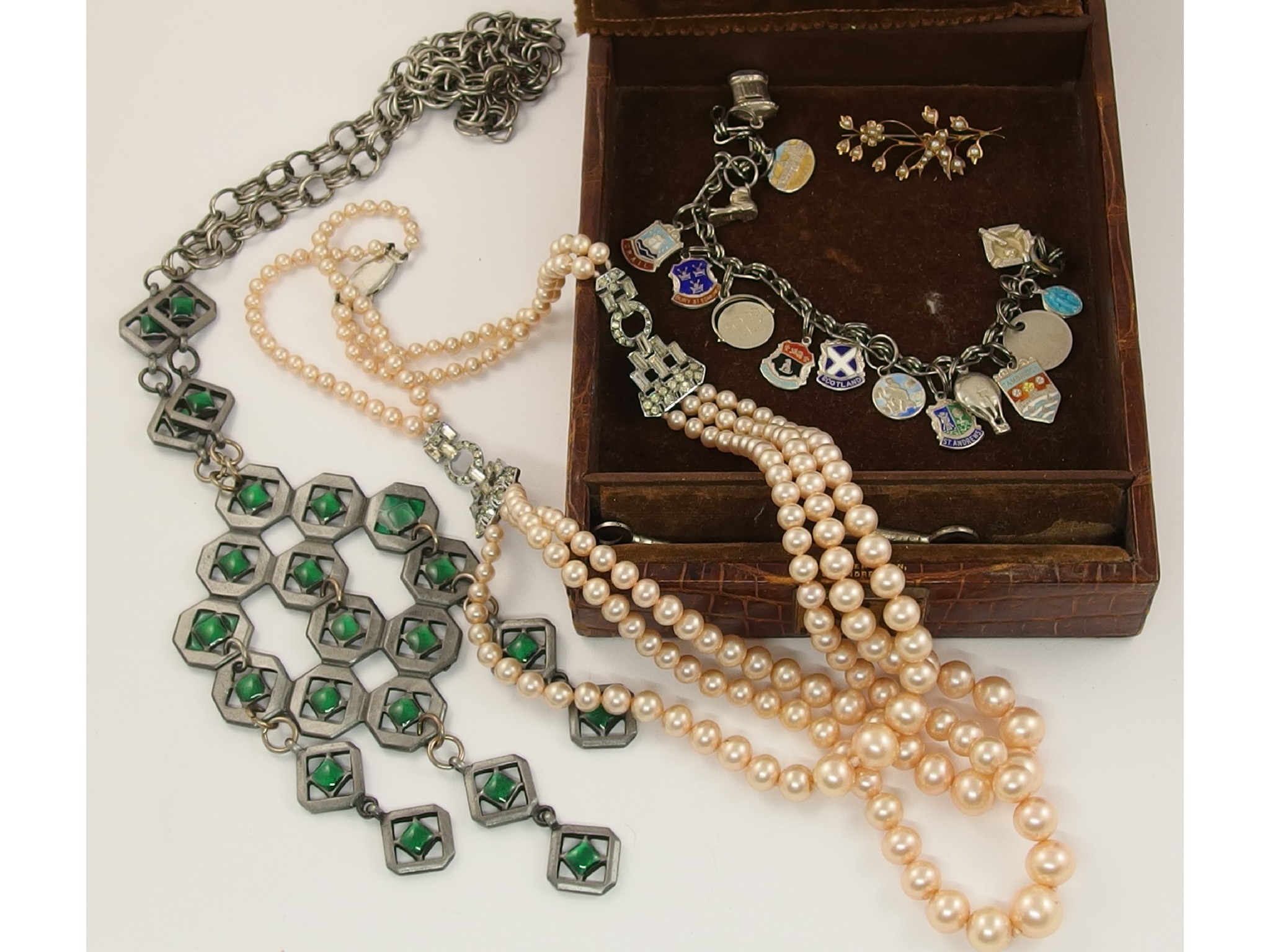 Appraisal: A silver charm bracelet and a collection of costume jewellery