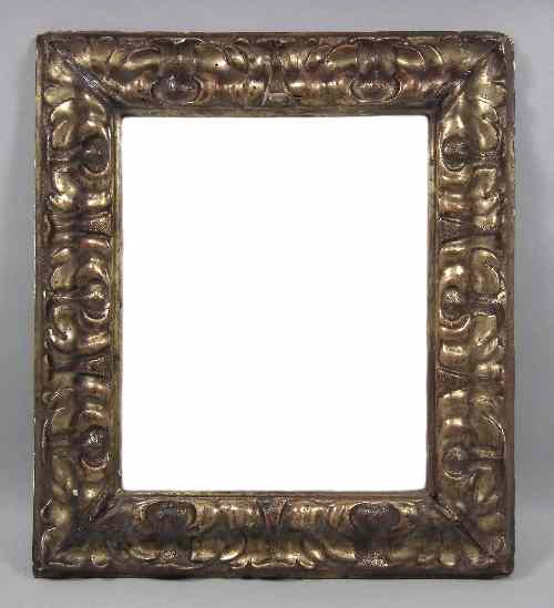 Appraisal: An Italian carved gilt wood rectangular mirror the moulded frame