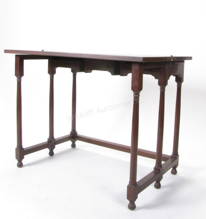 Appraisal: A Kittinger mahogany folding top sofa table with pull-out candle