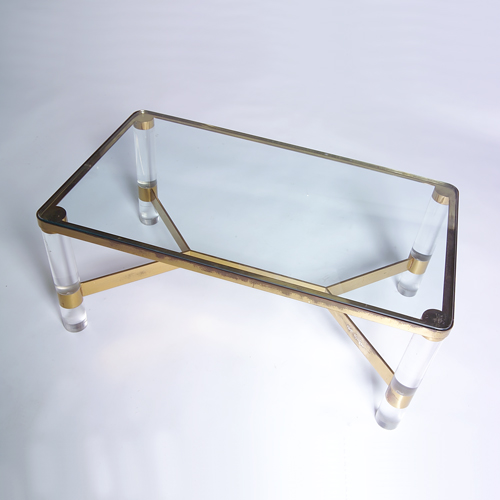 Appraisal: KARL SPRINGER Coffee table with inset plate glass top on