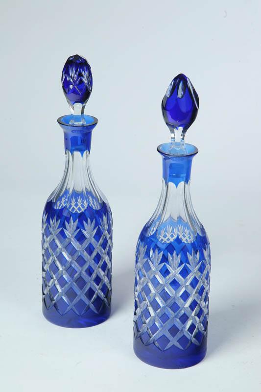 Appraisal: PAIR OF CUT OVERLAY GLASS DECANTERS American late th century