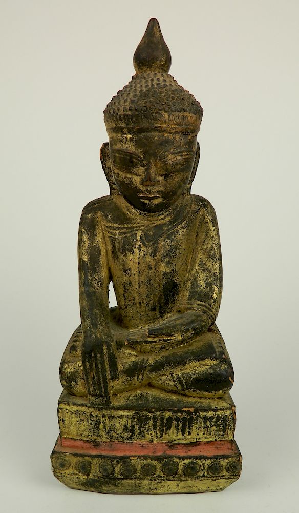 Appraisal: Carved and gilded wood Buddha th thc Carved and gilded