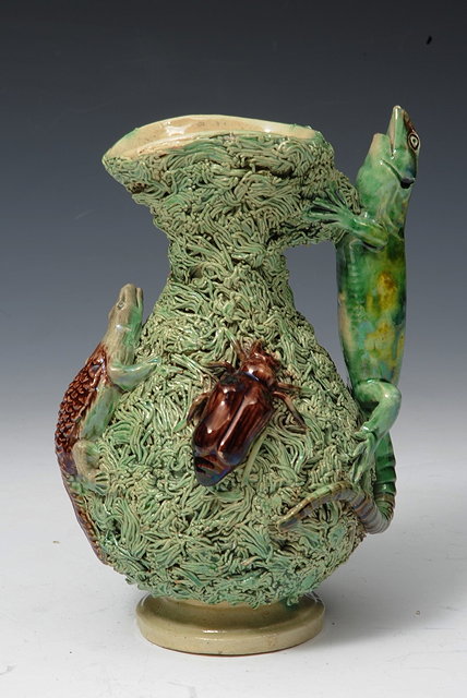 Appraisal: A PORTUGUESE PALISSY STYLE JUG the green moss ground applied