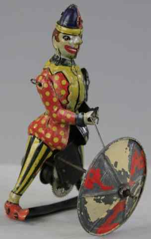 Appraisal: CLOWN WITH SPINNING UMBRELLA TOY Germany tin lithographed with hand