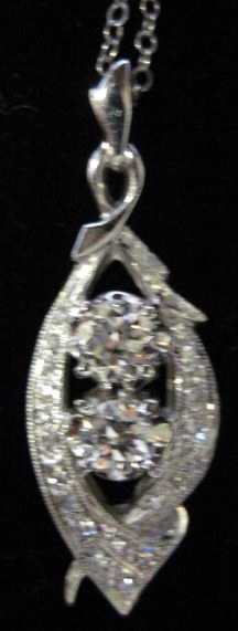 Appraisal: karat white gold and diamond pendantModified navette shape centering on