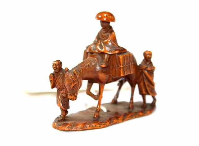 Appraisal: A JAPANESE BOXWOOD OKIMONO in the form of a horseman