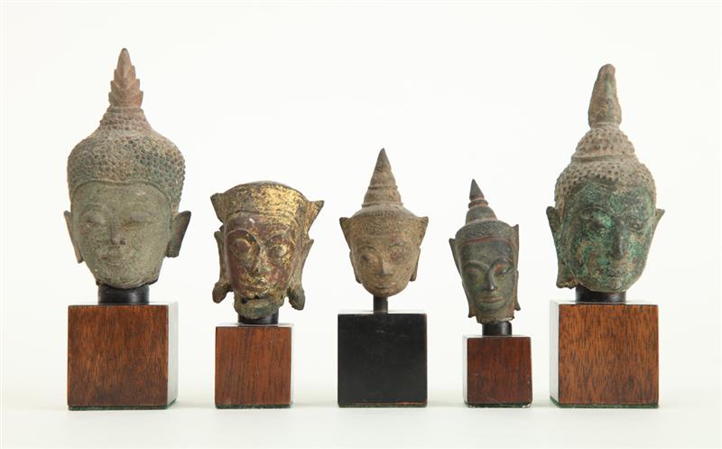 Appraisal: GROUP OF FIVE SOUTHEAST ASIAN BRONZE HEADS OF BUDDHA On