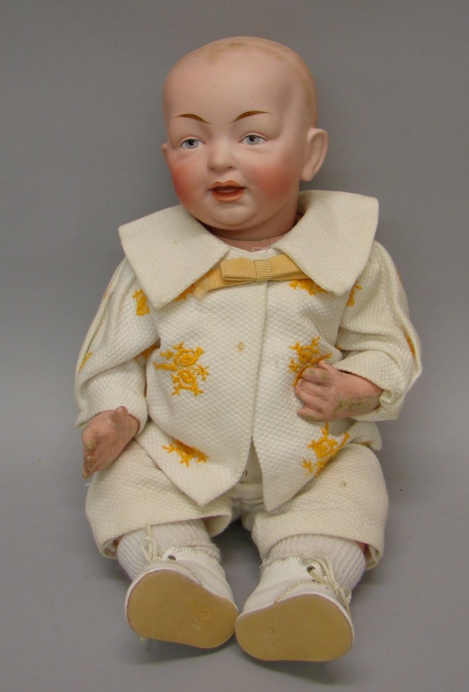 Appraisal: L cir Solid dome character baby Molded painted features -