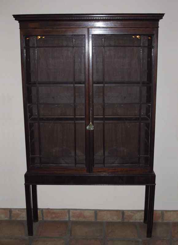 Appraisal: FINE MAHOGANY BOOKCASE CURIO DISPLAY Carved trim paneled glass doors