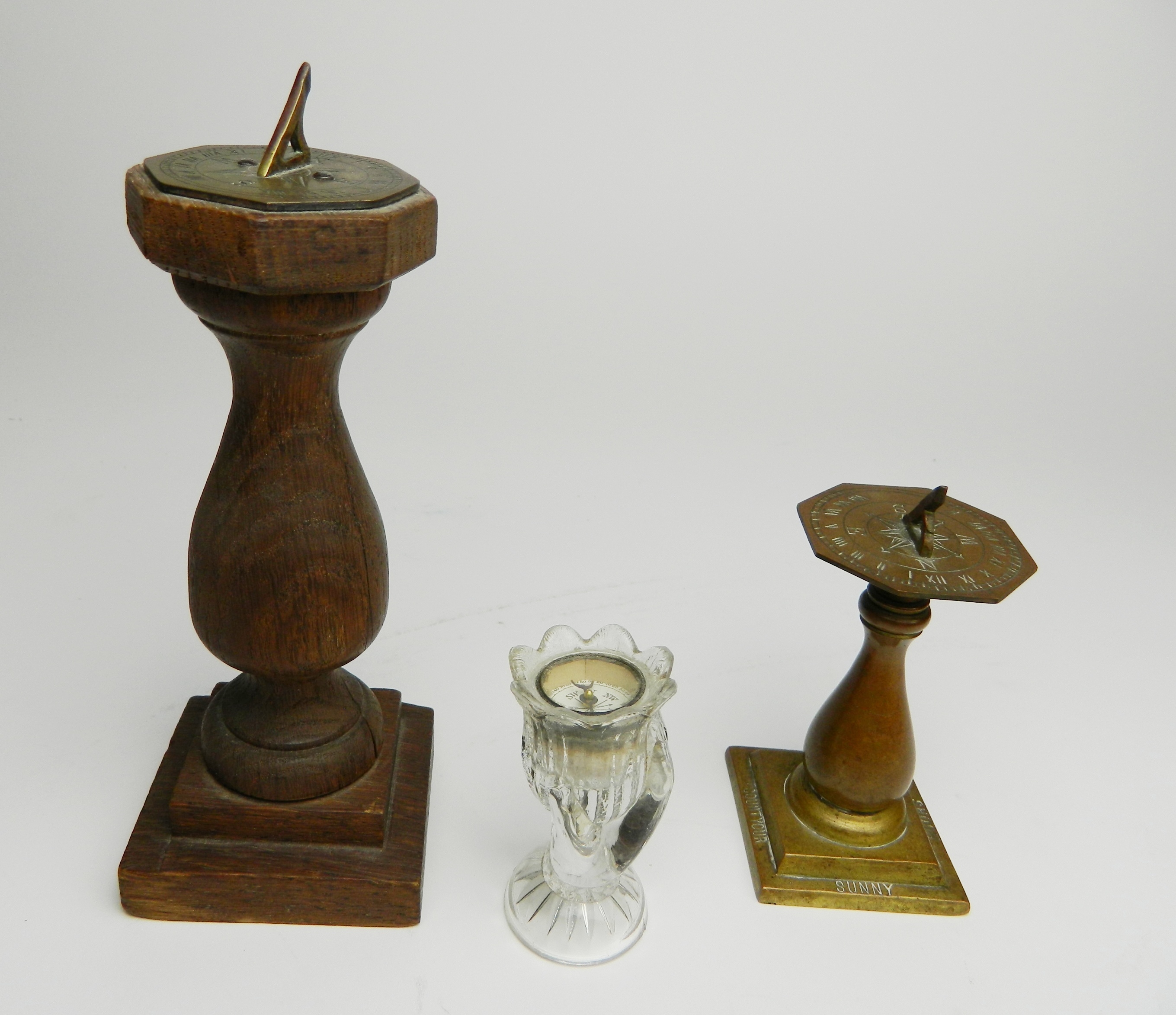 Appraisal: Sundial compasses are hexagonal shape st set on wood pedestal